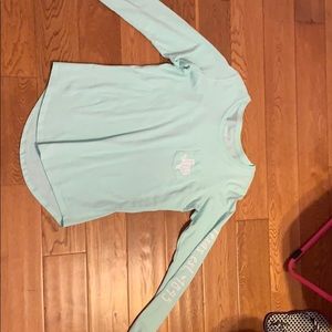 A teal Texas shirt with super cute designs